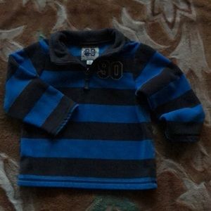 Stripped rugby fleece half zip top.